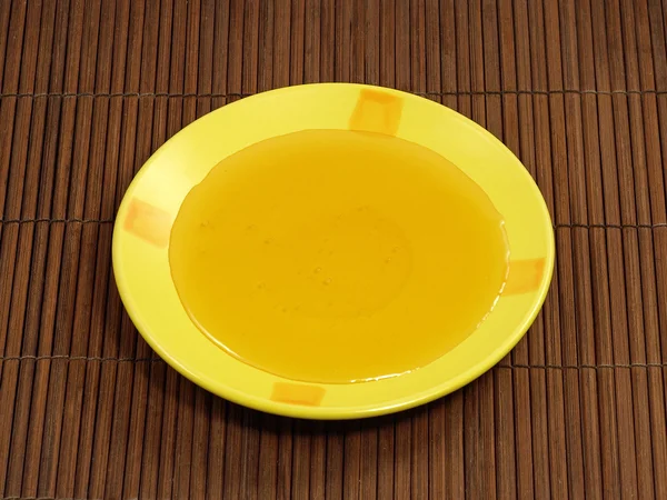 Мед в желтой тарелке . — стоковое фото