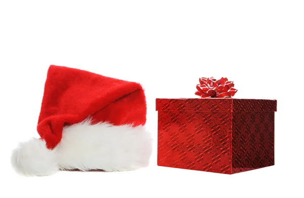 Santa hat and gift — Stock Photo, Image