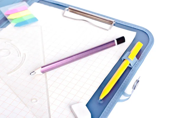 Clipboard with ball pen, setsquare, stickers, eraser and pencil — Stock Photo, Image