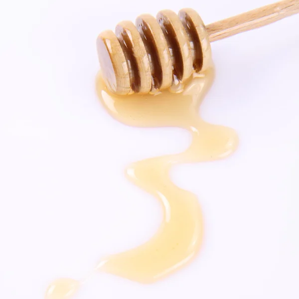 Honing op een honingstokje — Stockfoto