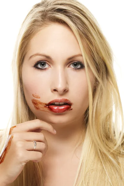 Beautiful blonde woman after eating chocolate — Stock Photo, Image