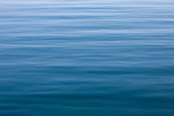 Blauer Wasserhintergrund Stockbild