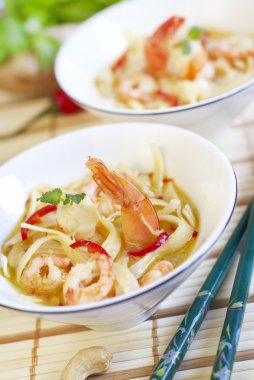 Thai spicy soup with noodles and shrimps clipart