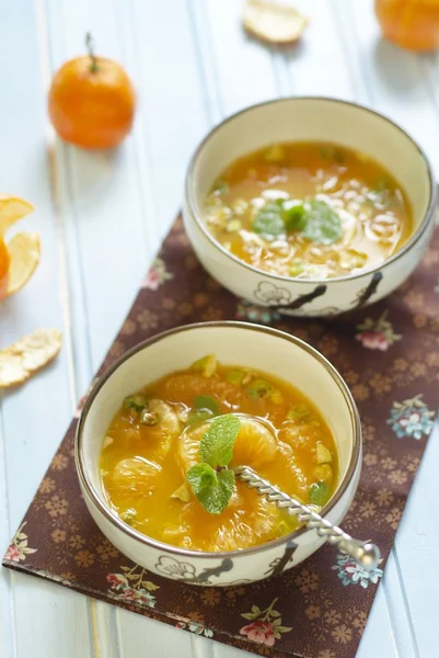 Mandarin soup with pistachios and mint — Stock Photo, Image