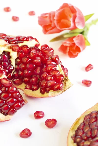 Pomegranate and flower — Stock Photo, Image