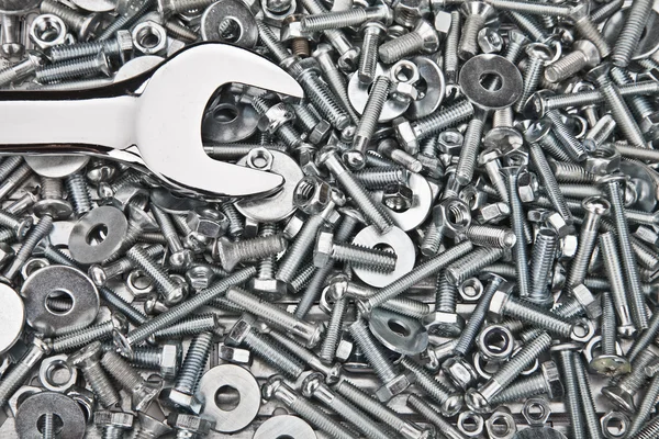Chrome spanner, nuts and bolts useful as a background — Stock Photo, Image