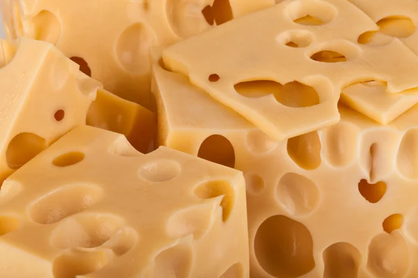 Hintergrund frischer gelber Schweizer Käse mit Löchern — Stockfoto