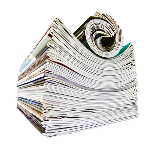 Várias revistas empilhadas e roladas sobre branco — Fotografia de Stock
