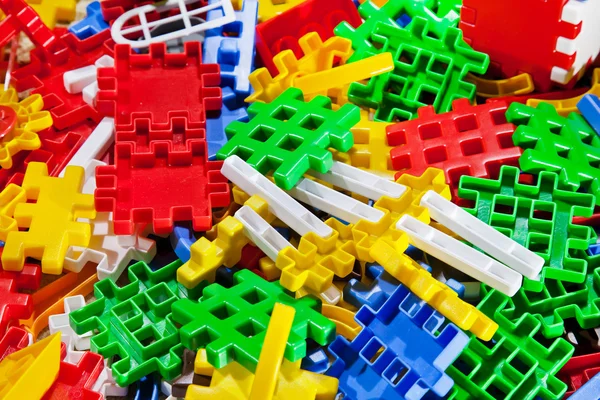 Plastdelarna på barns lek - bakgrund Royaltyfria Stockfoton