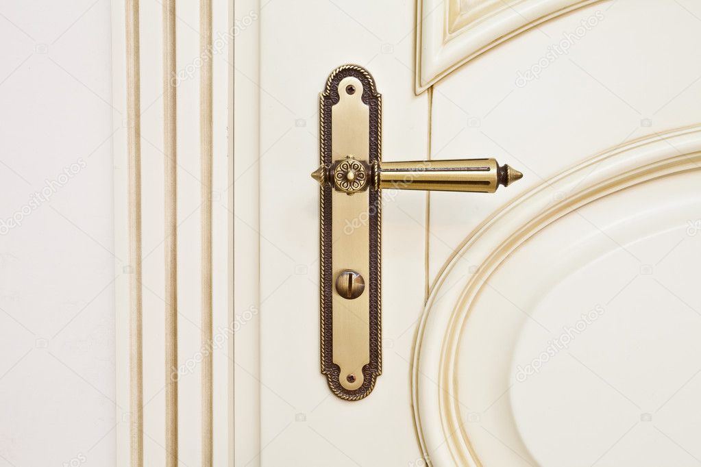 White wooden door with metallic door handle