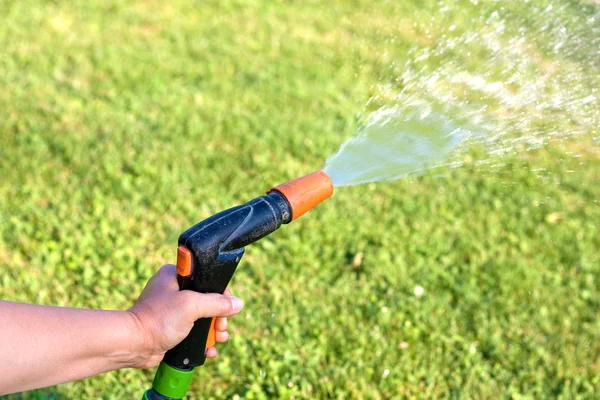 Watering the grass — Stock Photo, Image