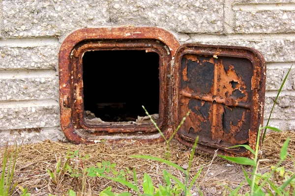Open old rusted iron door Stock Photo