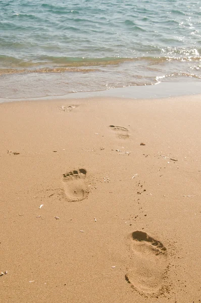 stock image Footprints on the beach