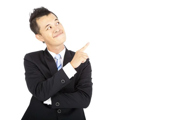 Hombre de negocios sonriente señalando y aislado en blanco —  Fotos de Stock