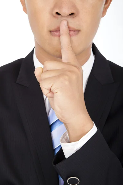Empresário mostrando gesto silencioso com o dedo — Fotografia de Stock