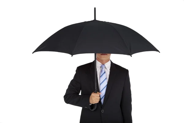 商人持有孤立在白色背景上的黑色雨伞 — 图库照片