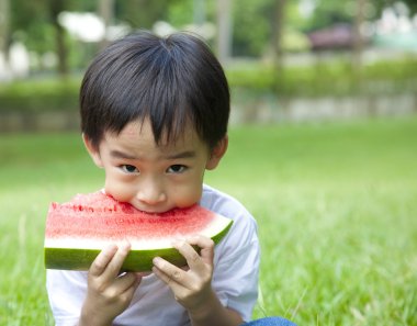 Boy eating watermelon