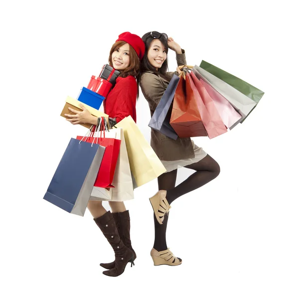 Happy asian fashion girls holding shopping bag and gift box — Stock Photo, Image