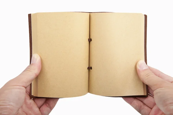 Открытая книга в руке изолированы на белом фоне — стоковое фото