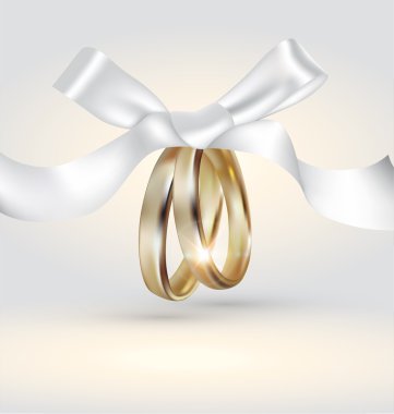Golden wedding rings with ribbon