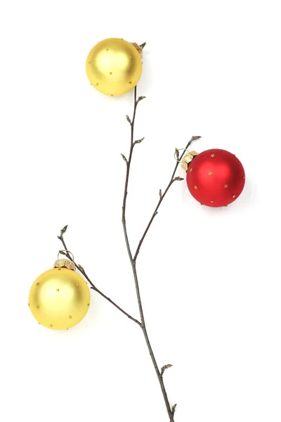 Twig with yellow and red baubles — Stock Photo, Image