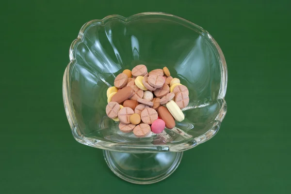 Glass with pills — Stock Photo, Image