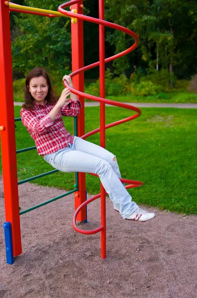 stock image Happy young woman on playground