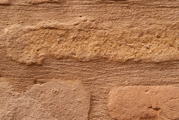 Viejo ladrillo pared marrón es primer plano — Foto de Stock