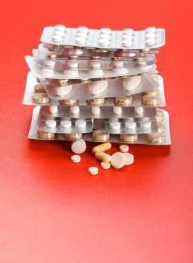 Pills in front of stacked blister