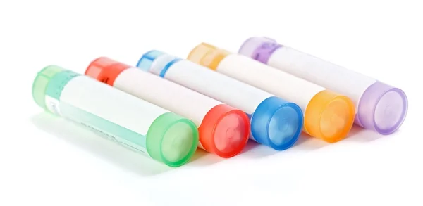 Renkli homeopatik ilaç kapları — Stok fotoğraf
