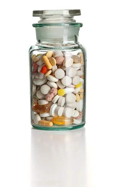 Garrafa química completa com pílulas coloridas — Fotografia de Stock