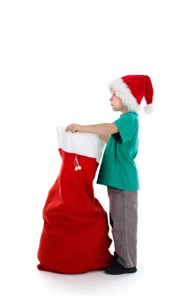 Jonge jongen houden santa-zak — Stockfoto