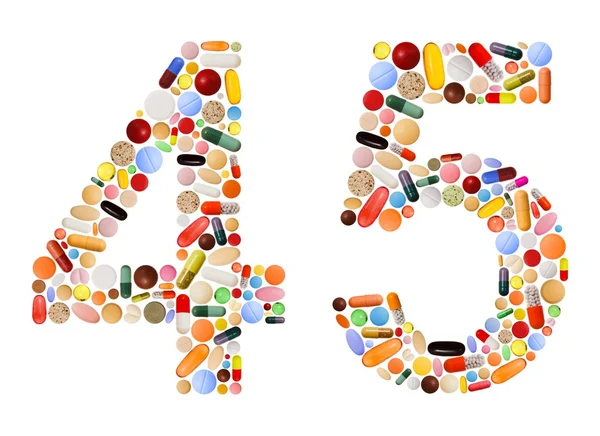 Номера 4 и 5 сделаны из различных красочных таблеток — стоковое фото
