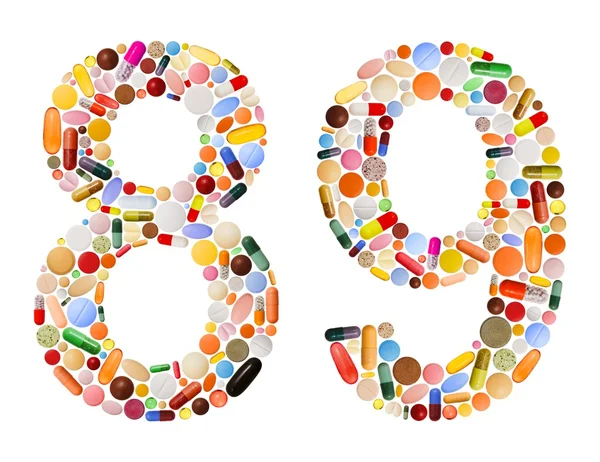 Números 8 e 9 feitos de várias pílulas coloridas — Fotografia de Stock