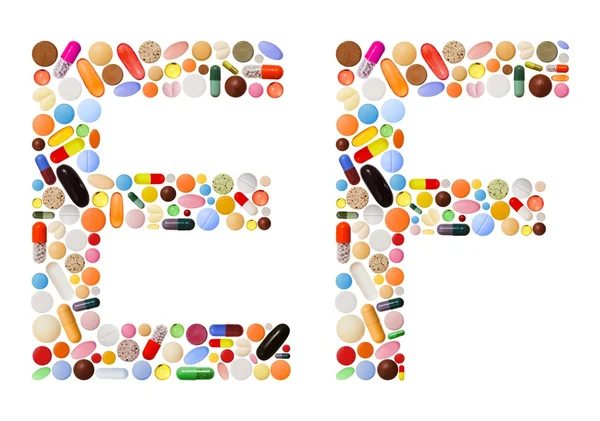 Tekens e en f gemaakt van kleurrijke pillen — Stockfoto