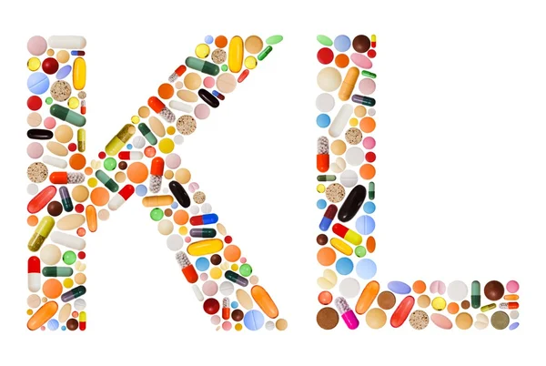 Personagens K e L feitos de pílulas coloridas — Fotografia de Stock