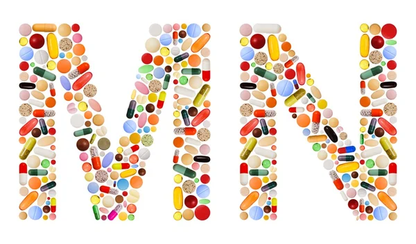 Znaky m a n z barevných pilulek — Stock fotografie