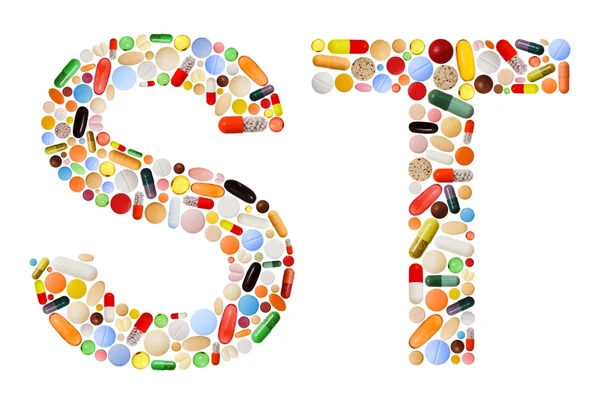 Personajes S y T hechos de píldoras de colores — Foto de Stock