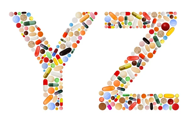 Personaggi Y e Z fatti di pillole colorate — Foto Stock