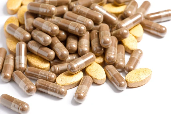 Las píldoras medicinales apilaron un montón — Foto de Stock