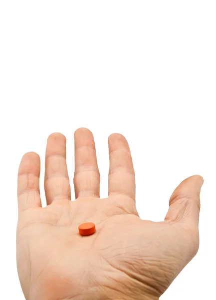Pil in een hand geïsoleerd op witte achtergrond — Stockfoto