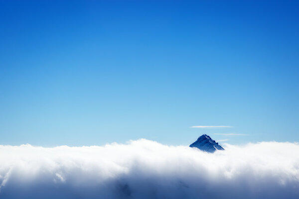 Mountain's top over clouds