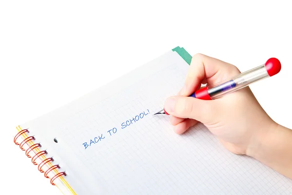 La mano del niño escribiendo palabras "volver a la escuela " — Foto de Stock