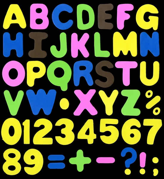 Алфавіт, зроблений з неонового кольору губки, як м'який пластик — стокове фото