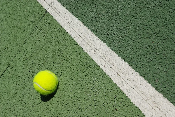 Tennis ball on court — Stock Photo, Image