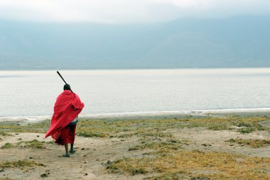 Masai in front of Empakai lake clipart