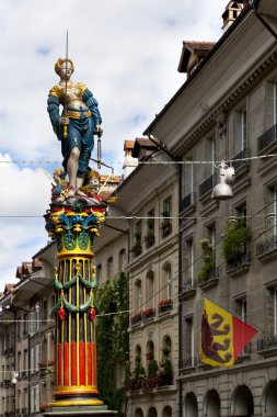 Blindfolded Lady Justice Sculpture in Kramgasse street in Bern, Switzerland clipart