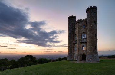 Broadway Tower with valley view after sunset Cotswolds, UK clipart