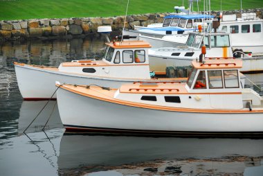 Fishing boats in harbor clipart