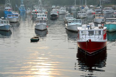 Fishing boats in harbor clipart